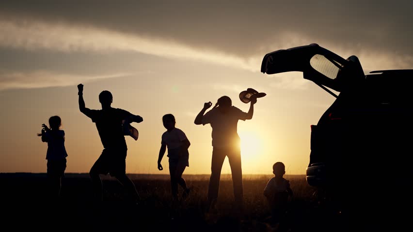 Happy family vacation travel. Silhouetted family dancing near car at sunset. Joyful family car vacation. Parents kids enjoy travel moments. Scenic family vacation travel. Outdoor fun during car travel