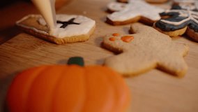 Close-Up of a Coffin-Shaped Cookie with a Black Cross, Decorated with White Icing. Preparation for Halloween. - Powered by Shutterstock - Get 15% off with code: PIKWIZARD15
