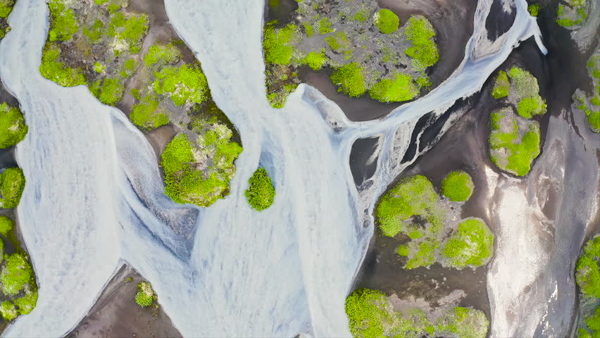 Aerial view of the torrents of water from the melting of the Fjallsjokull glacier, on its way to the sea, in southeast Iceland.