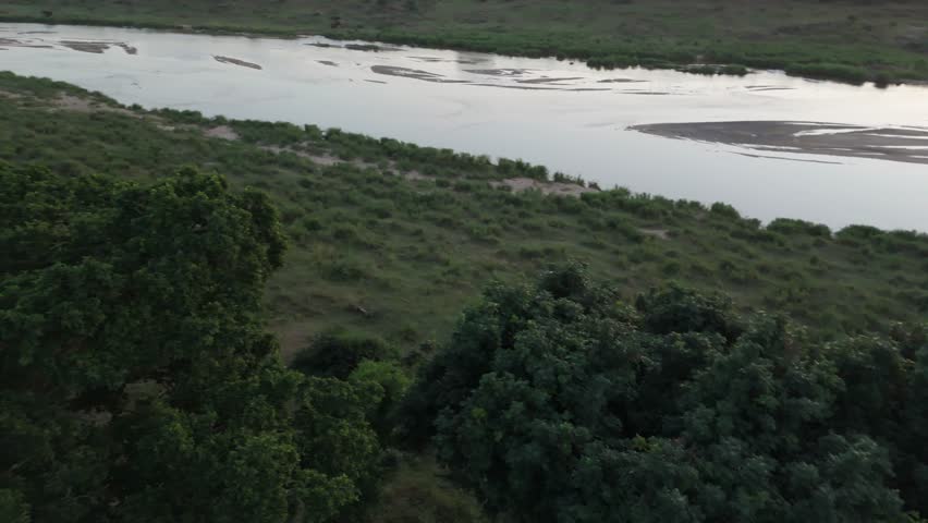 Slow Pan Up the river - Riverside Drone Footage, Near the Kruger National Park, Komatipoort, shot in 4K, Beautiful South African Landscape, Sunrise, Filmed in D-Log, 10 Bit