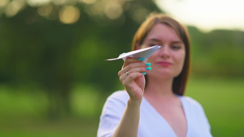 Mom With White Airplane At Sunset. Happy pregnant mom smiles and walks in the park with twins.Happy family enjoying summer holidays.
Happy Mom and twins smiling.