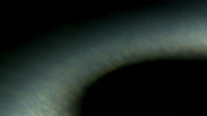 Crescent-like lens flare briefly illuminates the darkness