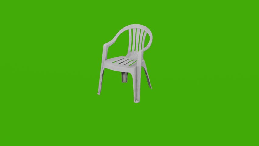 A white plastic chair rotates on a green screen
