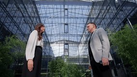 Handshake between businessman and businesswoman. Concept of corporate contract. - Powered by Shutterstock - Get 15% off with code: PIKWIZARD15