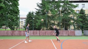 Volleyball players play volleyball without a net on an outdoor court. Training in digging, hitting, blocking, passing, and tactics. Volleyball practice on a sunny day - Powered by Shutterstock - Get 15% off with code: PIKWIZARD15