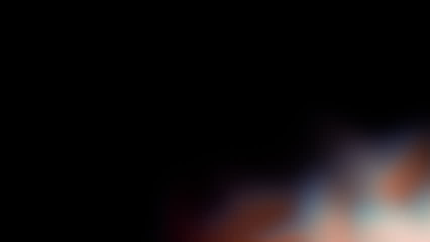 An abstract of a vibrant white blurry light effect on a black background