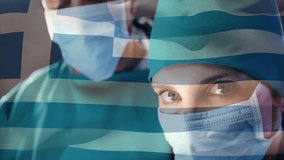 Animation of flag of greece over diverse surgeons. Global medicine, healthcare, connections, computing and data processing concept digitally generated video. - Powered by Shutterstock - Get 15% off with code: PIKWIZARD15