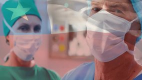 Animation of flag of chile over diverse surgeons in hospital. Global medicine, healthcare, flags and digital interface concept digitally generated video. - Powered by Shutterstock - Get 15% off with code: PIKWIZARD15