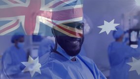 Animation of flag of australia over african american male surgeon in hospital. Global medicine, healthcare, flags and digital interface concept digitally generated video. - Powered by Shutterstock - Get 15% off with code: PIKWIZARD15