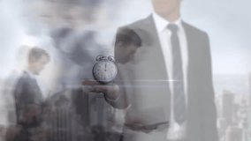 Animation of ticking alarm clock over businesspeople in fast motion. Global finance, business, connections, cloud computing and data processing concept digitally generated video. - Powered by Shutterstock - Get 15% off with code: PIKWIZARD15