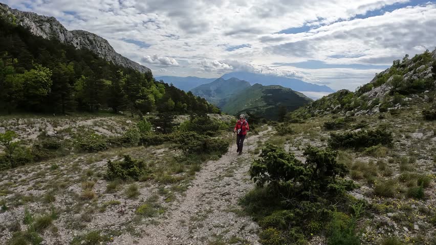 Senior woman hiking in Dalmatian mountains, Croatia