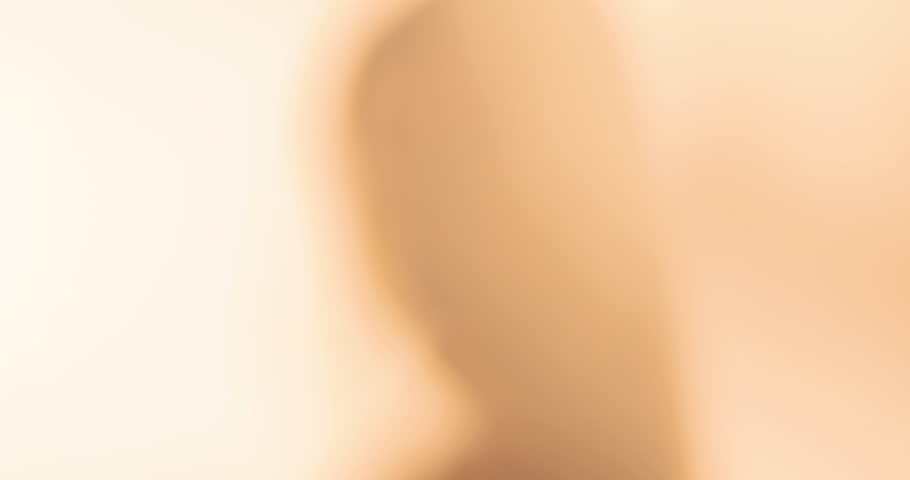 Portrait of a beautiful young Caucasian woman in a black shirt with on a white background.