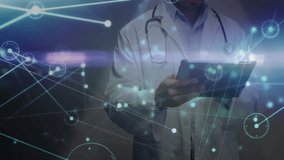 Animation of network of connections over biracial male doctor using tablet. Global medicine, healthcare, connections and digital interface concept digitally generated video. - Powered by Shutterstock - Get 15% off with code: PIKWIZARD15