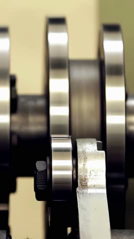Industrial Machine with Pistons and Crankshaft – Engine Components in Action. Close Up.
