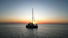 A beautiful sunset scene of a sailing boat in the sea under colorful dusk sky - Powered by Shutterstock - Get 15% off with code: PIKWIZARD15