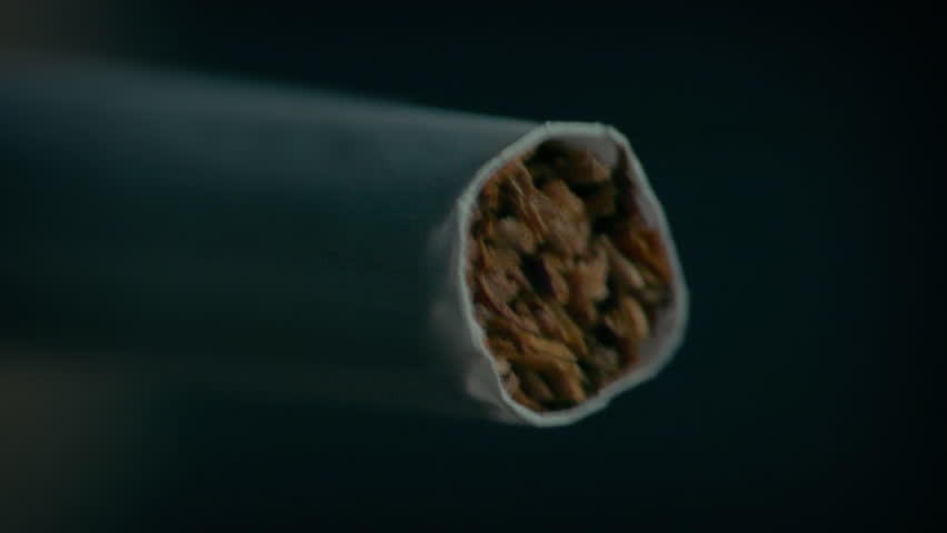 Cigarette Is Lit And Smoked Macro Shot