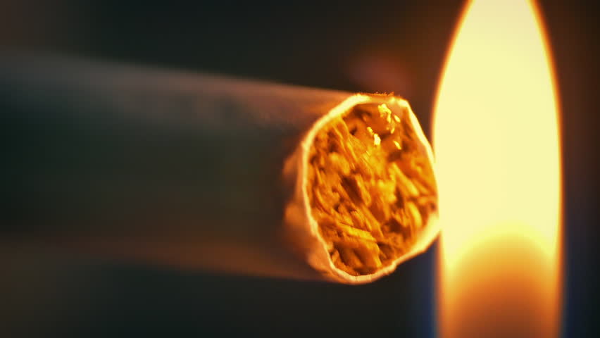 Cigarette Is Lit And Smoked Macro Shot