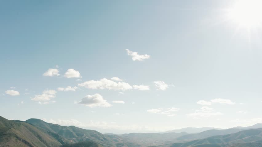 A drone scene over landscape Hierve el Agua green range mountains in Mexico