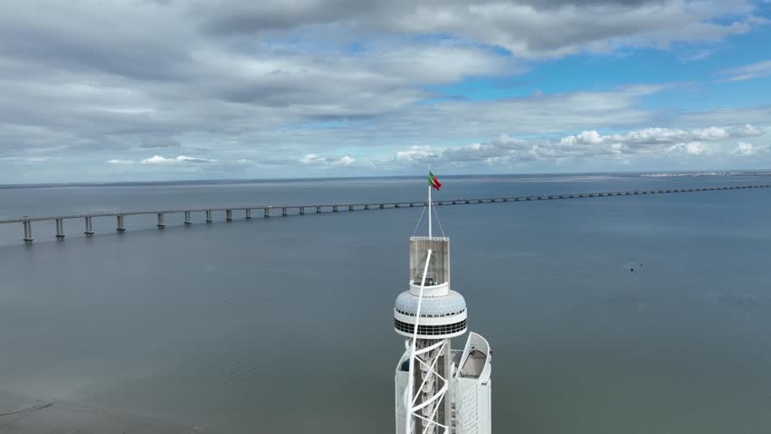 The Vasco da Gama Tower and Bridge in Background. Sightseeing Object in Lisbon, Portugal. 4k.