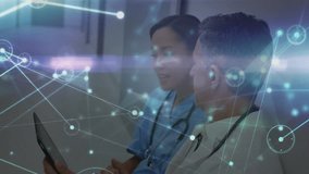 Animation of network of connections with light trails over diverse doctors in hospital. Global medicine, healthcare, connections and digital interface concept digitally generated video. - Powered by Shutterstock - Get 15% off with code: PIKWIZARD15