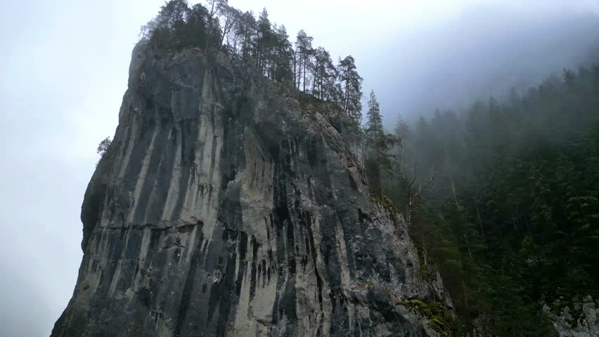 An aerial view of natural scenery in the Bizac Mountains and Red Lake in the winter in Romania