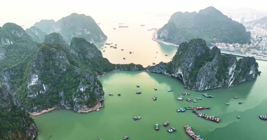Aerial view of Ha Long bay during daytime beautiful emerald green water. This is the UNESCO World Heritage Site, a beautiful natural wonder in northern Vietnam, Southeast Asia nature background.