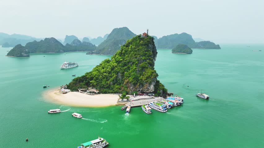 Aerial view of Ha Long bay during daytime beautiful emerald green water. This is the UNESCO World Heritage Site, a beautiful natural wonder in northern Vietnam, Southeast Asia nature background.