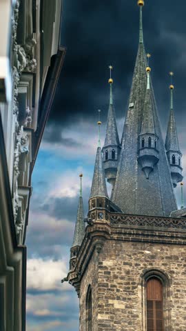 Close-up of the tower of the Church of Our Lady before Tyn. The spiers of the ancient European historical cathedral in Prague. Landmark against the sky.