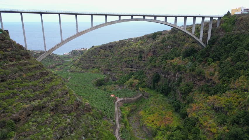 Cinematic view of the beautiful Los Tilos bridge on the island of La Palma and seeing banana trees. Canary islands spain.