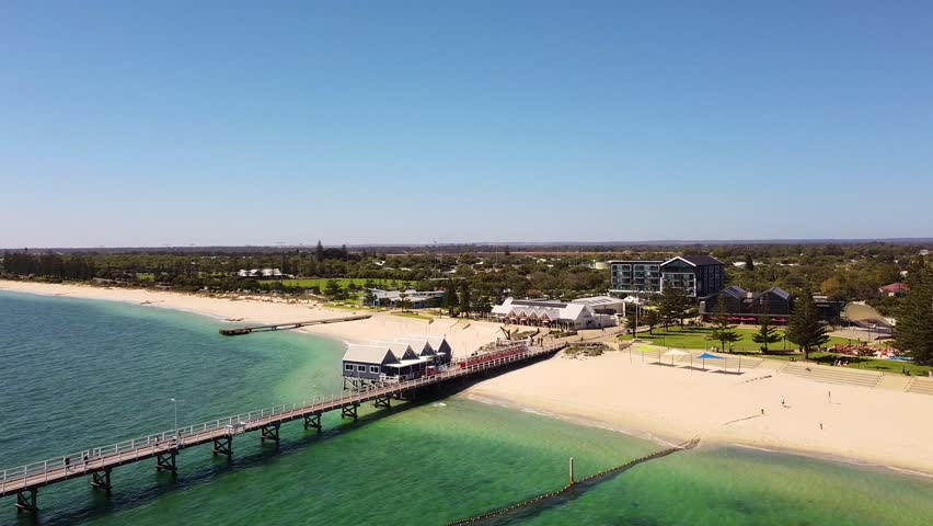 Busselton Jetty aerial forward view towards beachfront on summers day