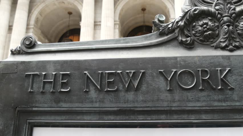 New York City, Manhattan Midtown Bryant Park. Public library building architecture, 42 street and 5th Fifth 5 avenue corner, United States. NYC landmark in USA. Facade exterior and sign.