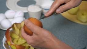 Woman peeling and cutting apples for apple cake on the kitchen - Powered by Shutterstock - Get 15% off with code: PIKWIZARD15
