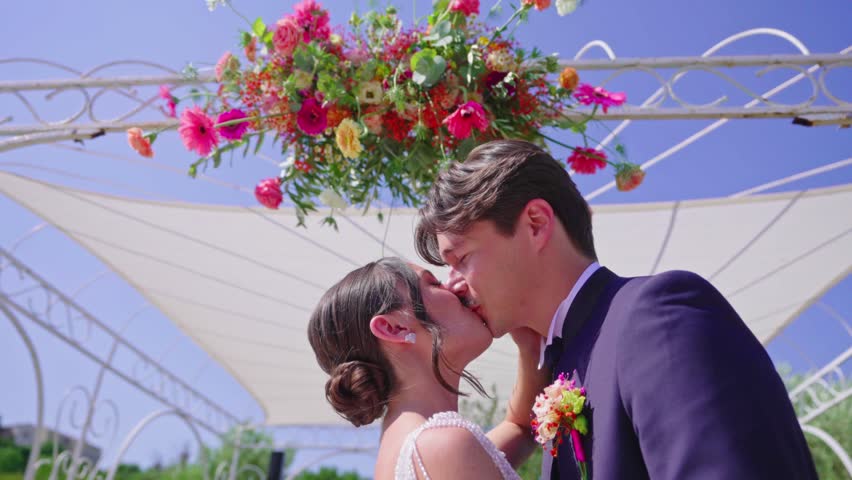 Bride and Groom Kissing at Ceremony