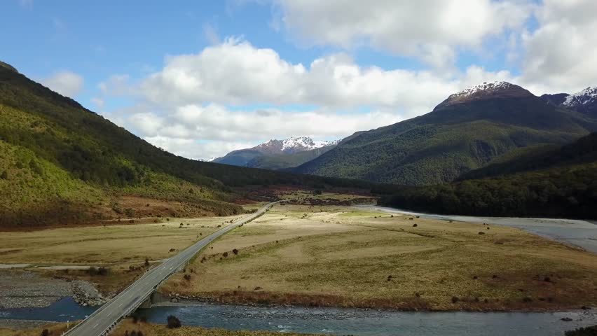An aerial view of a landscape with an empty road on South Island in New Zealand