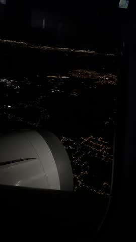 Night view of Toronto city from airplane board during the flight