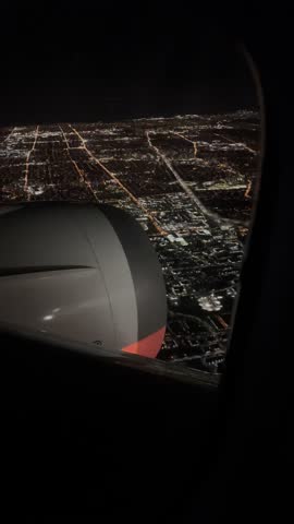 Night view of Toronto city from airplane board during the flight