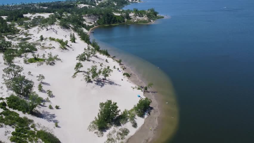 An aerial view of the coastline at Sandbanks Provincial Park Beach