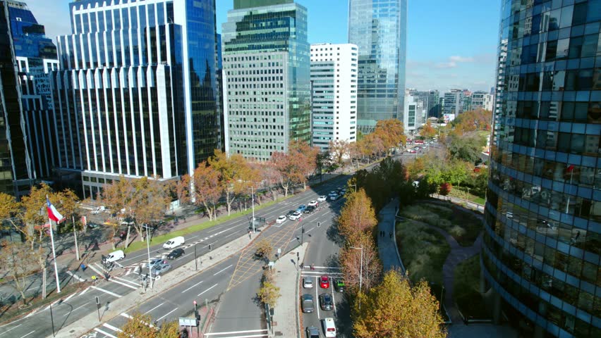 Aerial view of the financial center, modern buildings of Santiago de Chile, sunny autumn day, high vehicular traffic.