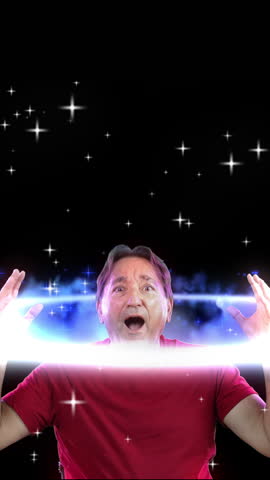 Vertical view of a man giving two mind blown meme gestures. Space background.	
