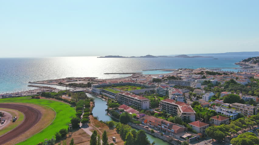 Marseille, France: Aerial view of famous French city by Mediterranean Sea, famous beaches Plages du Prado, summer day with clear blue sky - landscape panorama of Europe from above