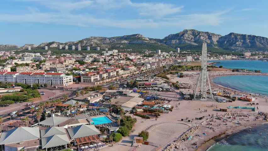 Marseille, France: Aerial view of famous French city by Mediterranean Sea, famous beaches Plages du Prado, summer day with clear blue sky - landscape panorama of Europe from above