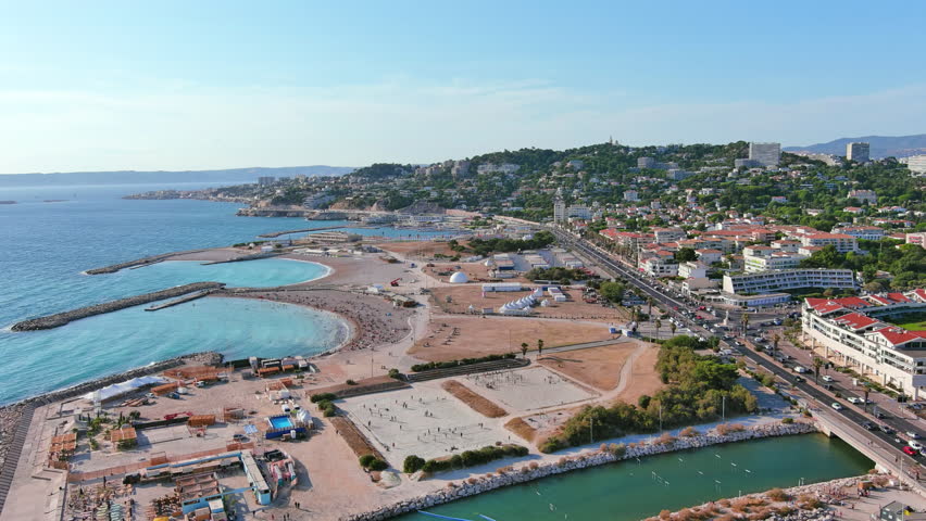 Marseille, France: Aerial view of famous French city by Mediterranean Sea, famous beaches Plages du Prado, summer day with clear blue sky - landscape panorama of Europe from above