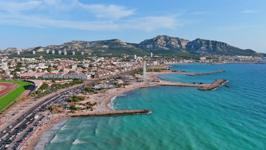 Marseille, France: Aerial view of famous French city by Mediterranean Sea, famous beaches Plages du Prado, summer day with clear blue sky - landscape panorama of Europe from above