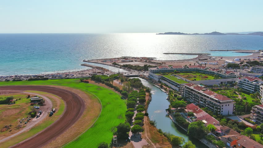 Marseille, France: Aerial view of famous French city by Mediterranean Sea, famous beaches Plages du Prado, summer day with clear blue sky - landscape panorama of Europe from above
