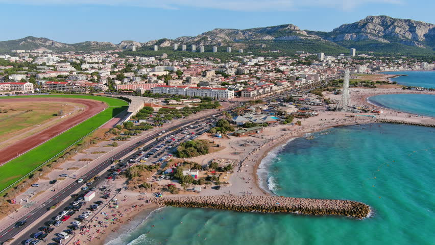 Marseille, France: Aerial view of famous French city by Mediterranean Sea, famous beaches Plages du Prado, summer day with clear blue sky - landscape panorama of Europe from above