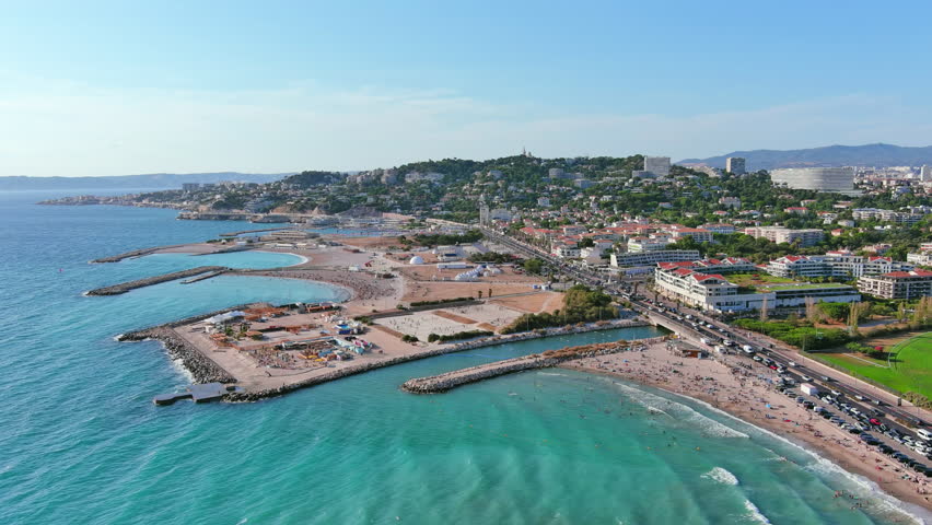 Marseille, France: Aerial view of famous French city by Mediterranean Sea, famous beaches Plages du Prado, summer day with clear blue sky - landscape panorama of Europe from above