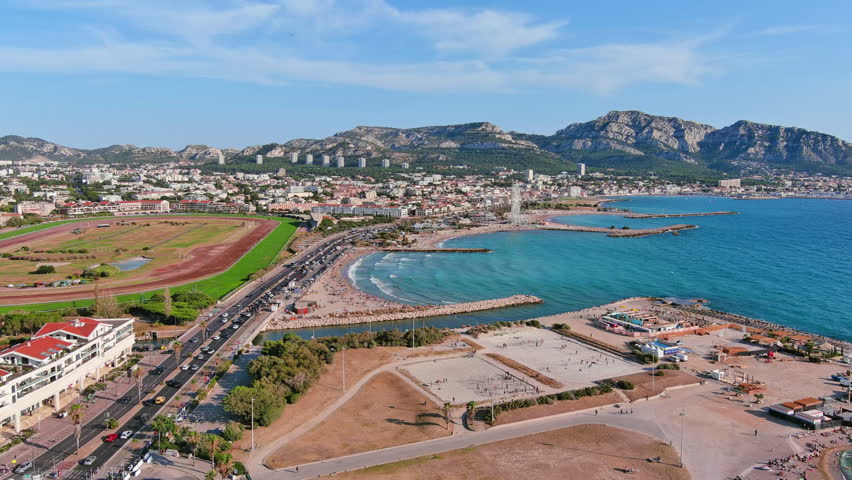 Marseille, France: Aerial view of famous French city by Mediterranean Sea, famous beaches Plages du Prado, summer day with clear blue sky - landscape panorama of Europe from above