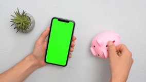 Woman hoarding,drops put coins in piggy bank,green screen chroma key.accumulation business.Save money,financial planning investment.securing future wealth.budget mastery, financial freedom. - Powered by Shutterstock - Get 15% off with code: PIKWIZARD15