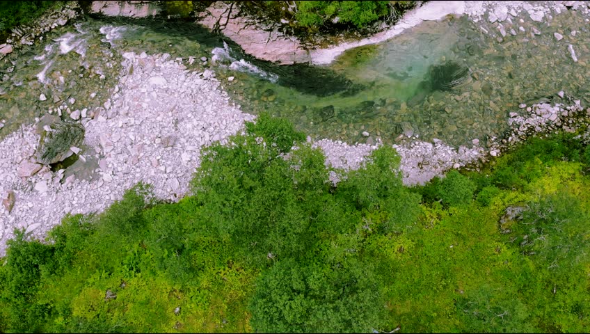 An aerial footage of scenic forest and river in Norway