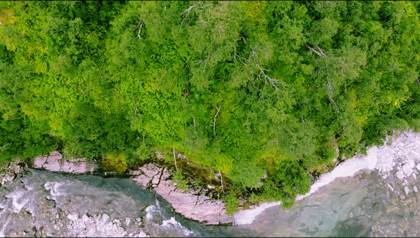 An aerial footage of scenic forest and river in Norway